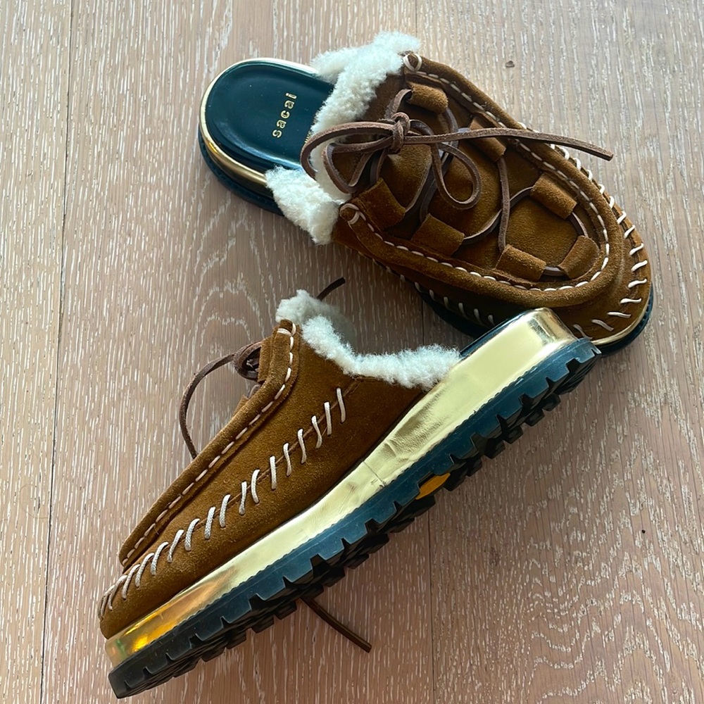 Sacai whipstitched shearling moccasin mules gold platform and vibram rubber sole